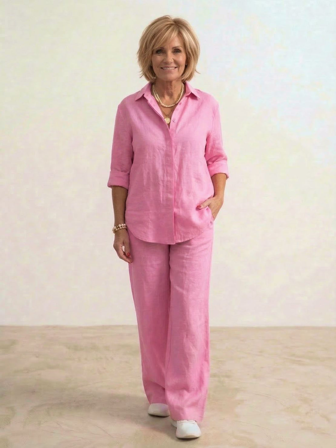 Woman wearing a two-piece co-ord set with a loose shirt and high-waist trousers.