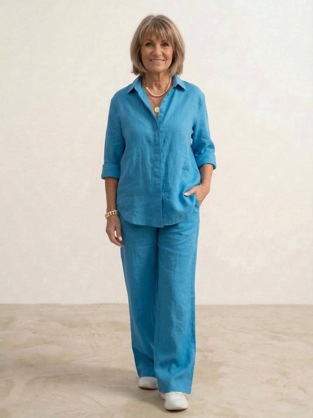 Woman in a matching casual co-ord set with a longline shirt and flowing trousers.