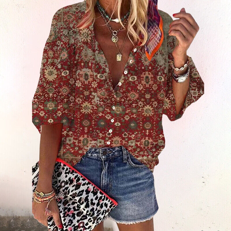 Female in a V-neck blouse featuring an intricate patterned design.