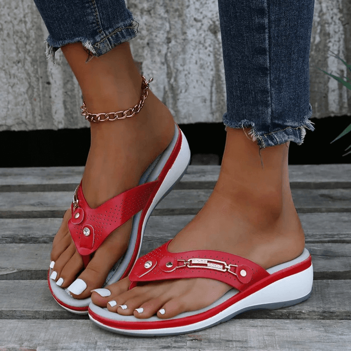 Female model showing lightweight summer sandals against a plain background.