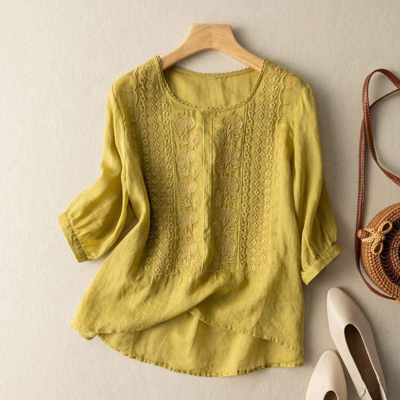 A casual blouse with intricate embroidered accents.
