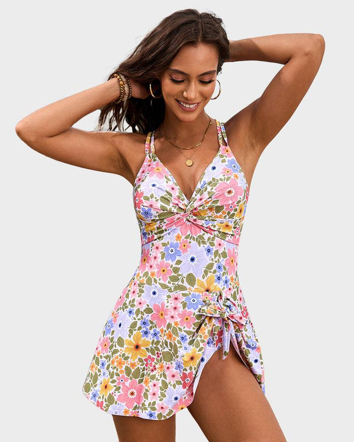 Female model posing in an elegant swim dress with front tie accent