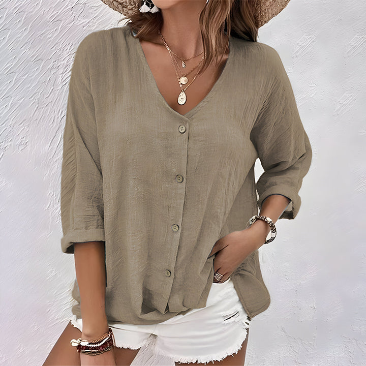 Female model wearing a casual V-neck top designed for everyday wear.