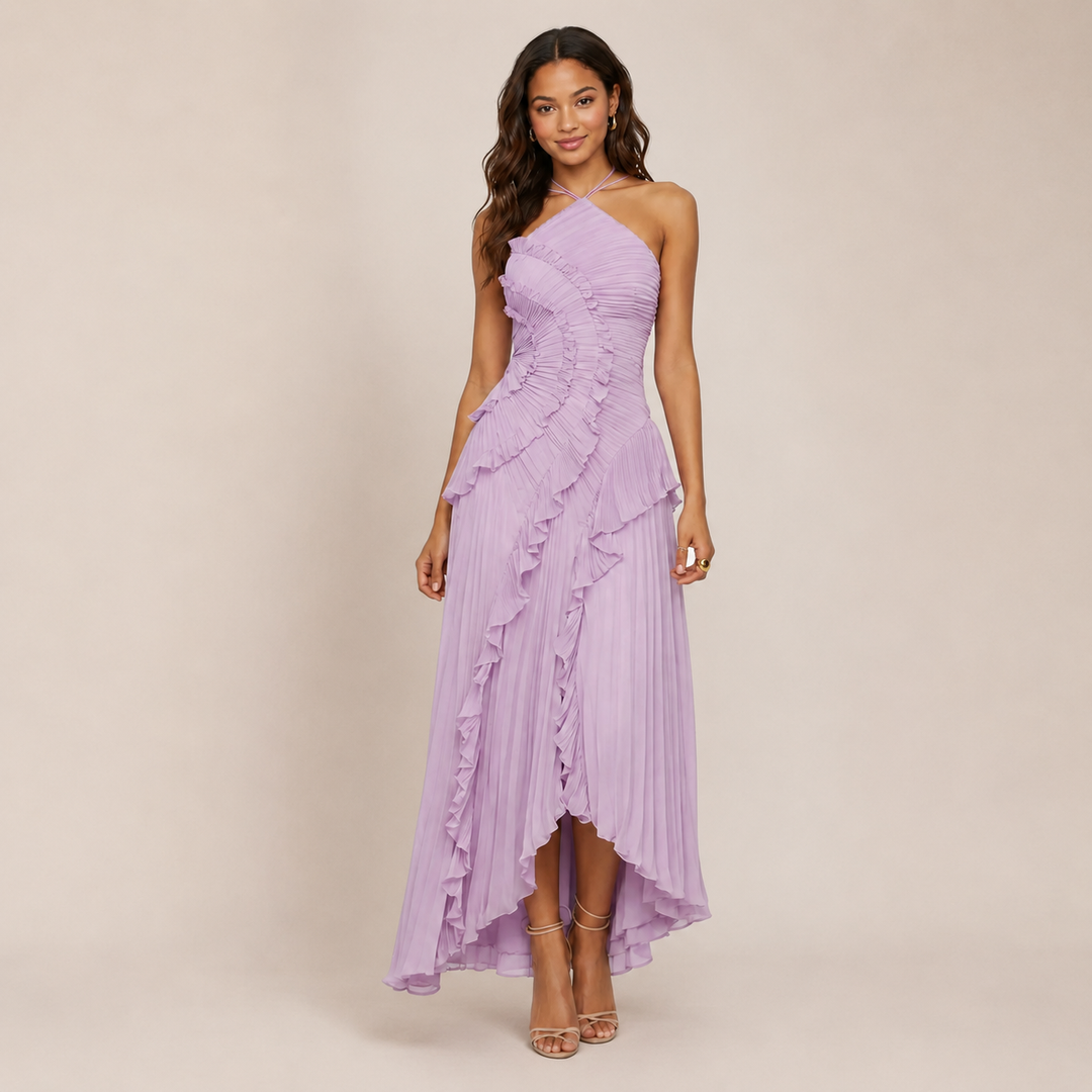 Female wearing a flowing ruffle halter A-line dress on a plain background.