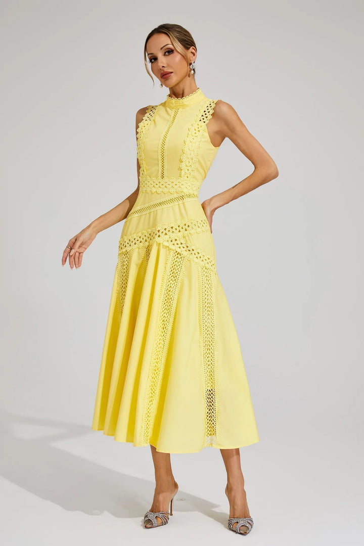 Woman styled in an occasion midi dress with a clean silhouette on a plain background.