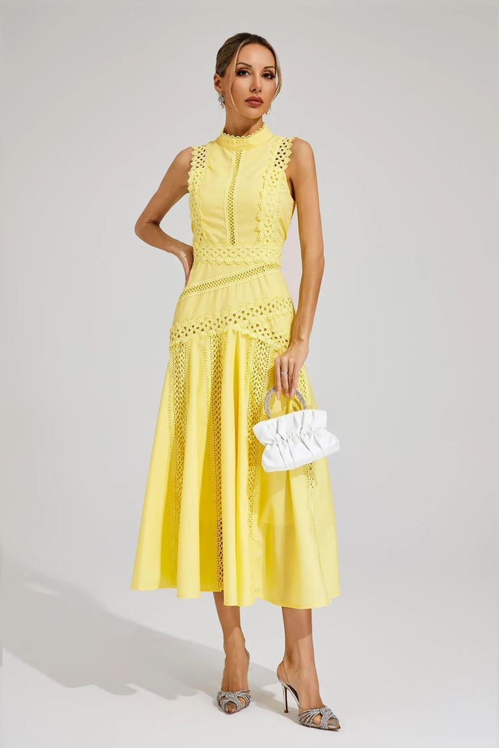 Female wearing a summer midi dress with a balanced fit on a plain background.