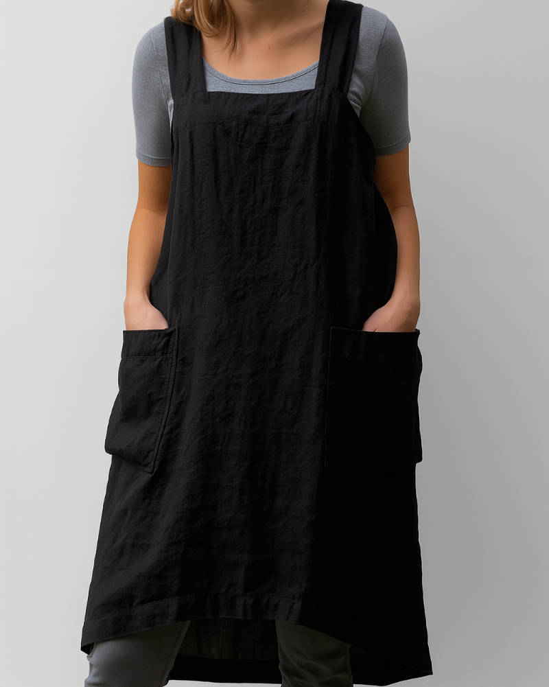 Woman in a sleeveless daily wear midi dress against a plain background.