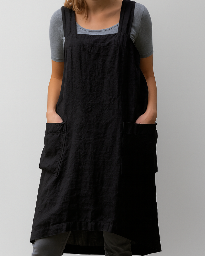 Woman in a sleeveless daily wear midi dress against a plain background.