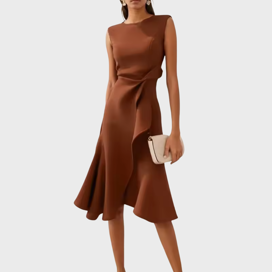 Female model wearing a relaxed printed midi dress with a V-neckline on a plain background.